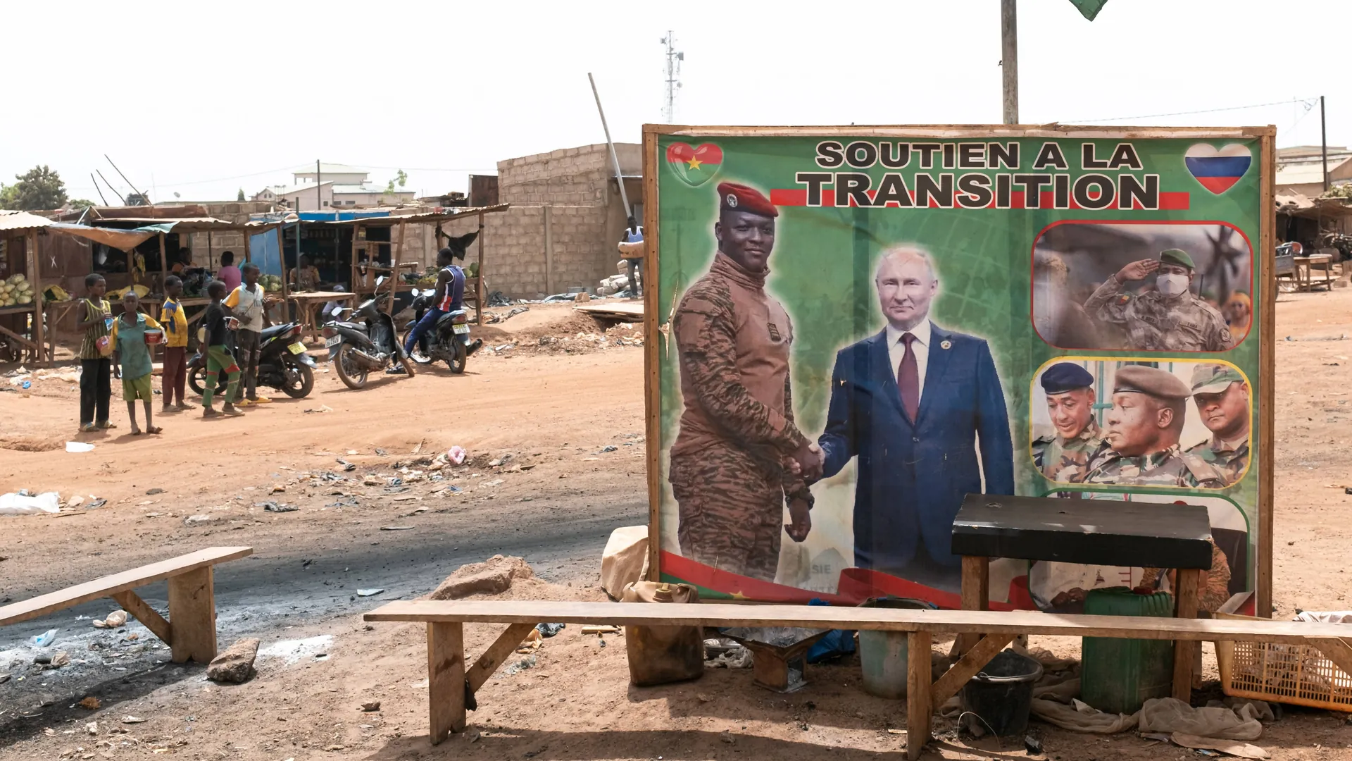 A poster in Burkina Faso's capital Ouagadougou shows interim head of state Touré with Russian President Vladimir Putin. A poster in Burkina Faso's capital Ouagadougou shows interim head of state Touré with Russian President Vladimir Putin.