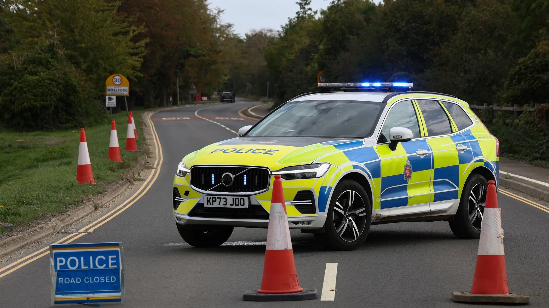 Police emergency vehicles cordon off the roads to the British air force base at Fairford. Police emergency vehicles cordon off the roads to the British air force base at Fairford.