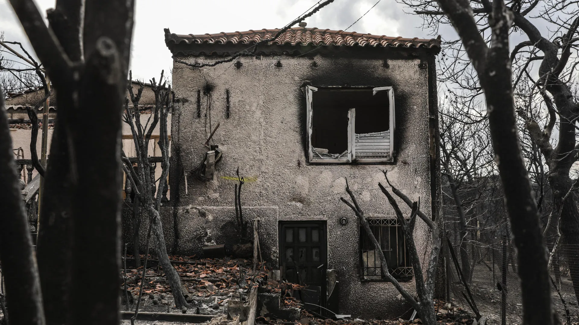 A burned house after a forest fire in the coastal town east of Athens: The flames destroyed more than 1,000 houses. A burned house after a forest fire in the coastal town east of Athens: The flames destroyed more than 1,000 houses.